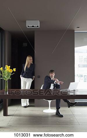 Couple work from home and enjoy looking at laptop. View Large Photo Image Stock Image - Couple work from home and enjoy looking at laptop.. Fotosearch