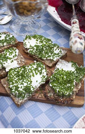 Cream cheese and chives on bread View Large Photo Image Stock Image - Cream cheese and chives on bread. Fotosearch