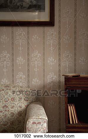 Detail of a chair and a bookshelf in an ornate living room View Large Photo Image Stock Image - Detail of a chair and a bookshelf in an ornate living room. Fotosearch