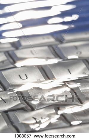 Detail of a computer keyboard underwater View Large Photo Image Stock Photo - Detail of a computer keyboard underwater. Fotosearch