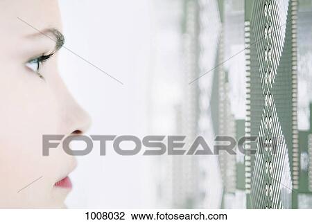 Stock Image - Detail of a woman looking at a pattern on a wall. Fotosearch