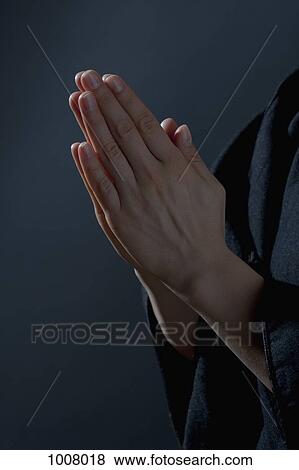 Detail of a woman praying View Large Photo Image Stock Photo - Detail of a woman praying. Fotosearch