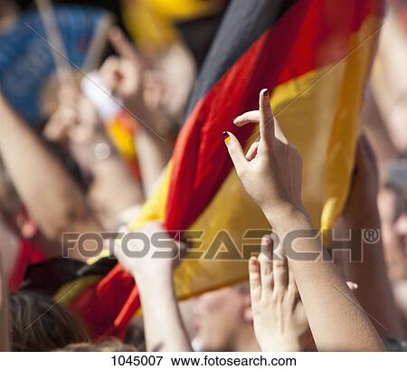 Detail of a woman raising her finger in a crowd View Large Photo Image Stock Photo - Detail of a woman raising her finger in a crowd. Fotosearch