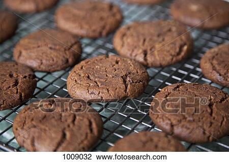Detail of chocolate cookies on a rack View Large Photo Image Stock Image - Detail of chocolate cookies on a rack. Fotosearch