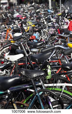 Detail of parked bicycles View Large Photo Image Stock Photograph - Detail of parked bicycles. Fotosearch