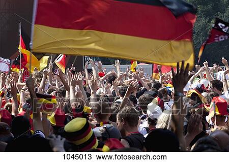 Detail of people in a crowd cheering and waving German flags View Large Photo Image Stock Image - Detail of people in a crowd cheering and waving German flags. Fotosearch