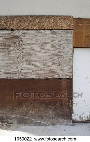Different pieces of wood used to board up a building View Large Photo Image Stock Image - Different pieces of wood used to board up a building. Fotosearch