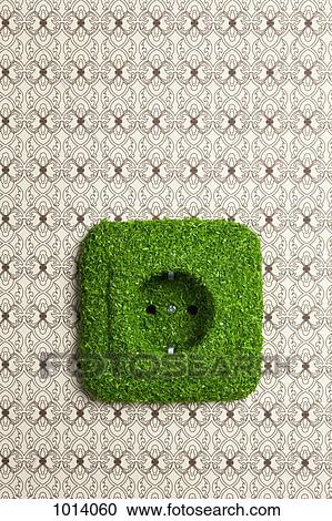 Energy saving electrical wall outlet covered in grass View Large Photo Image Stock Image - Energy saving electrical wall outlet covered in grass. Fotosearch