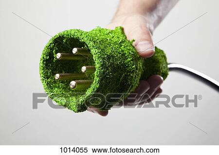 Energy saving power cable covered in green grass View Large Photo Image Stock Photography - Energy saving power cable covered in green grass. Fotosearch