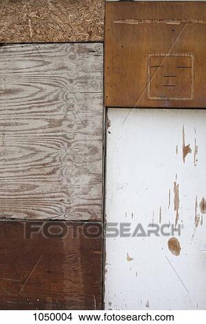 Picture - Five different pieces of wood used to board up a structure. Fotosearch