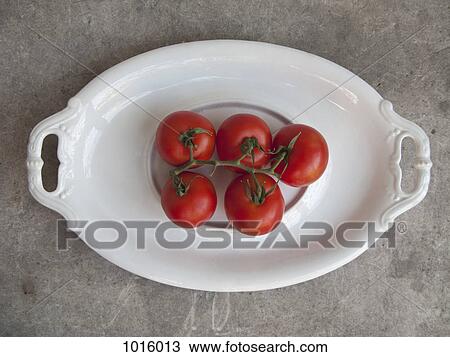 Five tomatoes on dish. View Large Photo Image Stock Image - Five tomatoes on dish.. Fotosearch