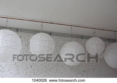 Five white round paper lanterns hanging in a row View Large Photo Image Stock Photograph - Five white round paper lanterns hanging in a row. Fotosearch