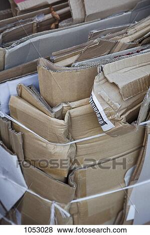 Flattened cardboard boxes tied with twine and ready to be recycled View Large Photo Image Stock Photo - Flattened cardboard boxes tied with twine and ready to be recycled. Fotosearch