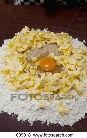 Flour, butter, sugar and an egg on a kitchen bench View Large Photo Image Stock Photo - Flour, butter, sugar and an egg on a kitchen bench. Fotosearch