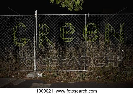 GREEN spelt on a chain link fence View Large Photo Image Stock Image - GREEN spelt on a chain link fence. Fotosearch