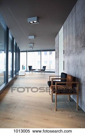 Hall in modern apartment with wooden floor and empty chairs. View Large Photo Image Stock Photography - Hall in modern apartment with wooden floor and empty chairs.. Fotosearch