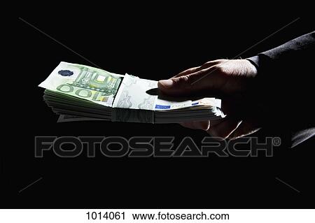 Hand holding stack of money View Large Photo Image Stock Image - Hand holding stack of money. Fotosearch