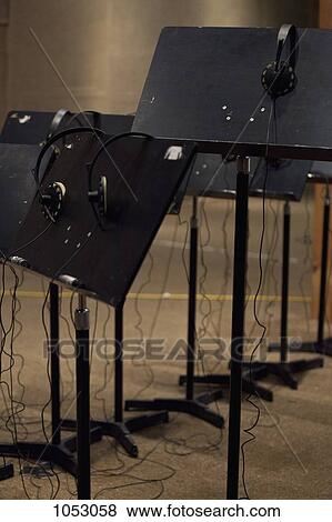 Stock Photo - Headphones and music stands in a recording studio. Fotosearch