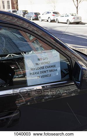 Humorous anti-theft sign hanging in a car window View Large Photo Image Stock Image - Humorous anti-theft sign hanging in a car window. Fotosearch