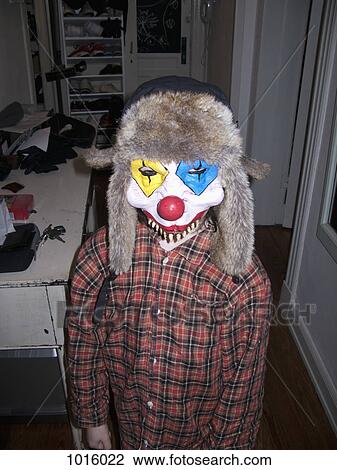 Kid with scary clown mask. View Large Photo Image Stock Image - Kid with scary clown mask.. Fotosearch