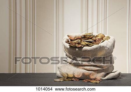 Large sack full of euro coins on a table View Large Photo Image Picture - Large sack full of euro coins on a table. Fotosearch