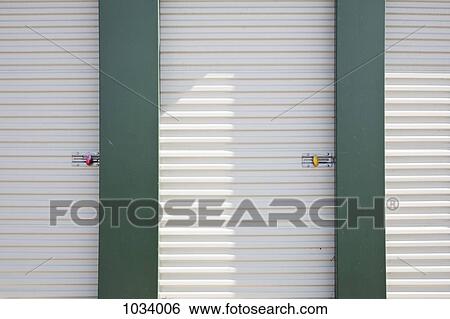 Locked storage units at a self storage facility View Large Photo Image Stock Photograph - Locked storage units at a self storage facility. Fotosearch
