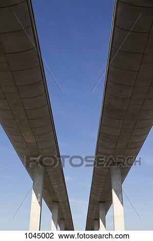 Low angle view of concrete overpasses View Large Photo Image Stock Image - Low angle view of concrete overpasses. Fotosearch