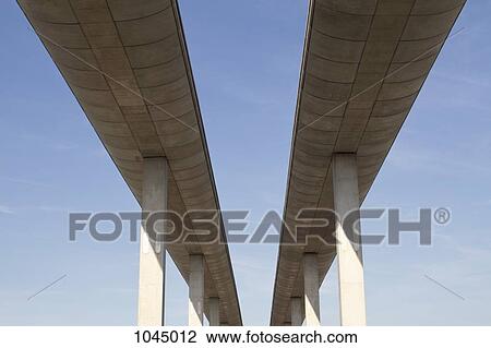 Low angle view of concrete overpasses View Large Photo Image Stock Image - Low angle view of concrete overpasses. Fotosearch