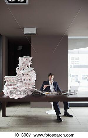 Many pizzas for businessman at home. View Large Photo Image Stock Photo - Many pizzas for businessman at home.. Fotosearch