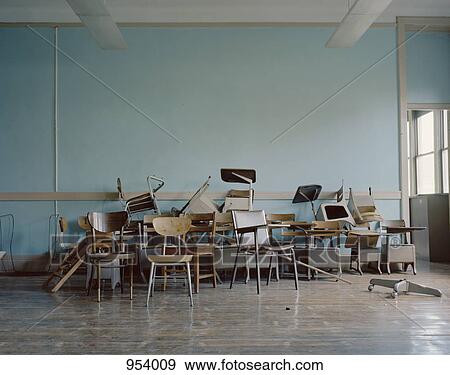 Old, broken chairs in an abandoned school View Large Photo Image Stock Photo - Old, broken chairs in an abandoned school. Fotosearch