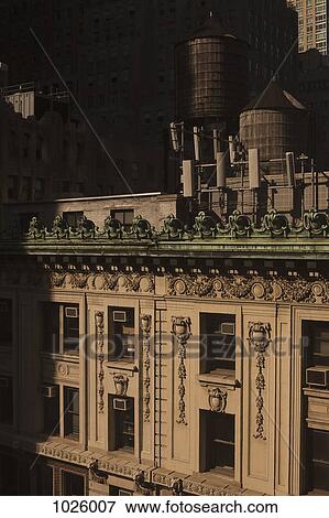 Old-fashioned wooden water storage tanks on the roof of a luxury apartment building, Manhattan View Large Photo Image Stock Photo - Old-fashioned wooden water storage tanks on the roof of a luxury apartment building, Manhattan. Fotosearch