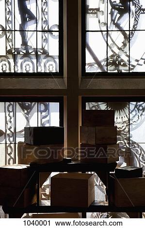 Old wooden boxes inside of a room with clockworks outside the windows View Large Photo Image Stock Image - Old wooden boxes inside of a room with clockworks outside the windows. Fotosearch