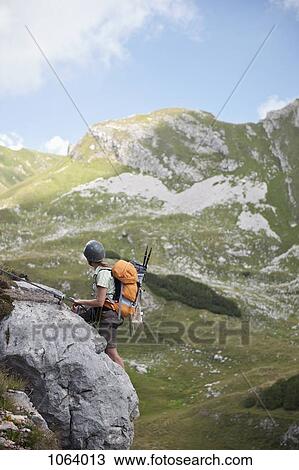 Person climbing rock face at The Wetterstein, Tirol, Austria, View Large Photo Image Stock Image - Person climbing rock face at The Wetterstein, Tirol, Austria,. Fotosearch