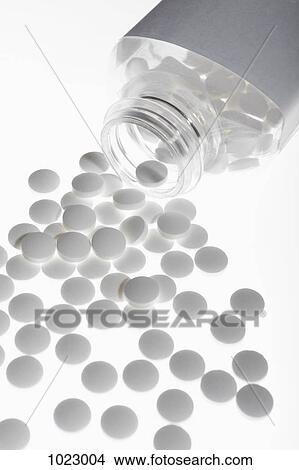 Picture - Pills spilling from a pill bottle. Fotosearch