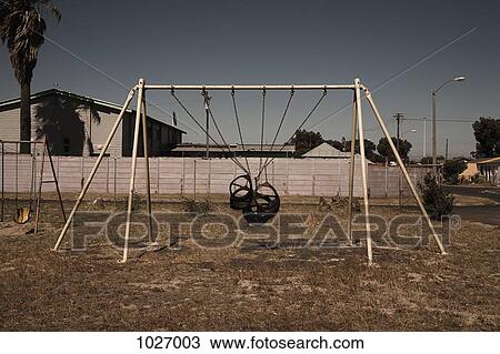 Play park swing with the seats tied up View Large Photo Image Stock Image - Play park swing with the seats tied up. Fotosearch
