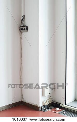 Stock Photo - Plugs in the corner.. Fotosearch