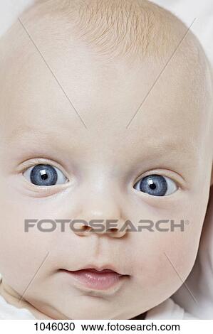 Stock Image - Portrait of a baby's face, close-up. Fotosearch