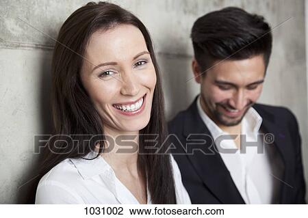 Portrait of a businesswoman and businessman, head and shoulders, focus on woman View Large Photo Image Stock Image - Portrait of a businesswoman and businessman, head and shoulders, focus on woman. Fotosearch