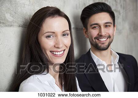 Portrait of a businesswoman and businessman, head and shoulders, focus on woman View Large Photo Image Stock Image - Portrait of a businesswoman and businessman, head and shoulders, focus on woman. Fotosearch