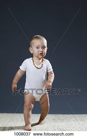 Stock Photo - Portrait of a toddler walking. Fotosearch