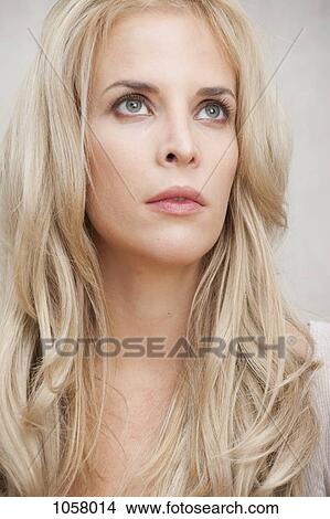 portrait of woman with blonde hair looking up View Large Photo Image Picture - portrait of woman with blonde hair looking up. Fotosearch