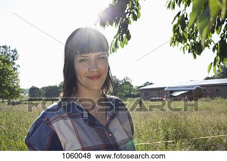 Profile of girl standing in field View Large Photo Image Stock Photo - Profile of girl standing in field. Fotosearch
