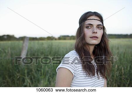 Profile of girl with hair band standing in field looking to the side View Large Photo Image Stock Image - Profile of girl with hair band standing in field looking to the side. Fotosearch