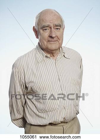 Profile of senior man with hands behind back looking at camera View Large Photo Image Stock Image - Profile of senior man with hands behind back looking at camera. Fotosearch