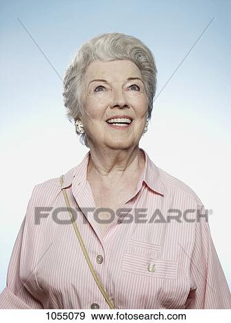 Profile of senior woman smiling and looking up View Large Photo Image Stock Photo - Profile of senior woman smiling and looking up. Fotosearch