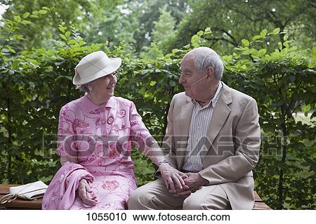 Romantic senior couple on bench in the park View Large Photo Image Stock Image - Romantic senior couple on bench in the park. Fotosearch