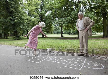 Senior couple play hopscotch View Large Photo Image Picture - Senior couple play hopscotch. Fotosearch