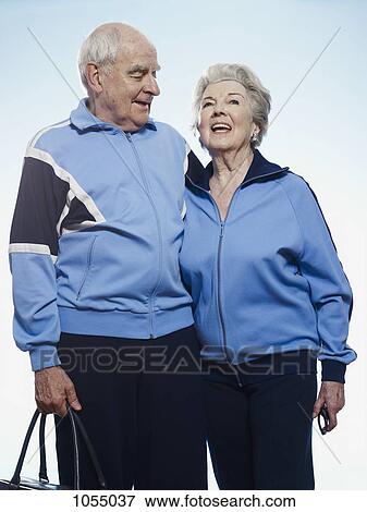 Senior couple wearing tracksuits ready for sport View Large Photo Image Stock Photo - Senior couple wearing tracksuits ready for sport. Fotosearch
