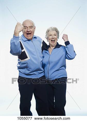 Senior man and woman in sportswear cheering View Large Photo Image Stock Photo - Senior man and woman in sportswear cheering. Fotosearch