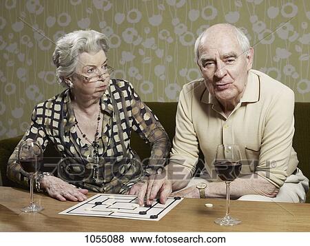 Senior woman looks shocked by man's muehle tactics View Large Photo Image Stock Photo - Senior woman looks shocked by man's muehle tactics. Fotosearch